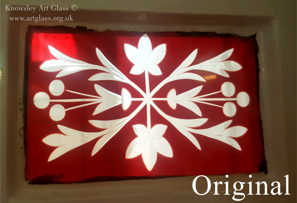 Broken red flashed brilliant cut glass panel next to newly reproduced replacement panel